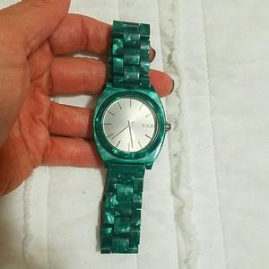 Nixon emerald green watch.